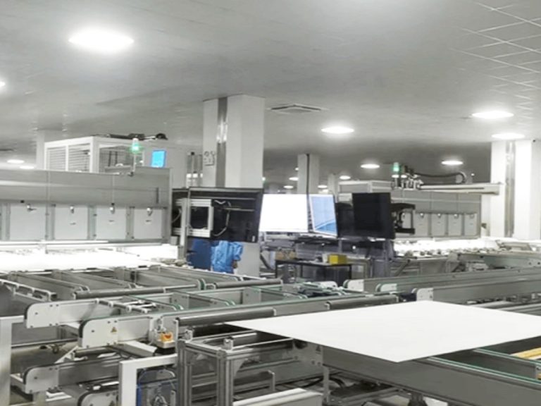 Weltrus solar panel factory hall with module conveyors and process monitors