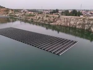 Floating solar array on a rock-sided reservoir, photographed from above